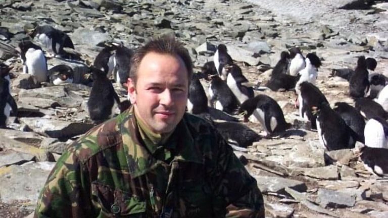 man and penguins