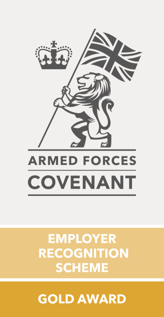 Armed Forces Covenant logo with a lion holding a British flag under a crown, and text reading “Employer Recognition Scheme Gold Award” on gold and white background.