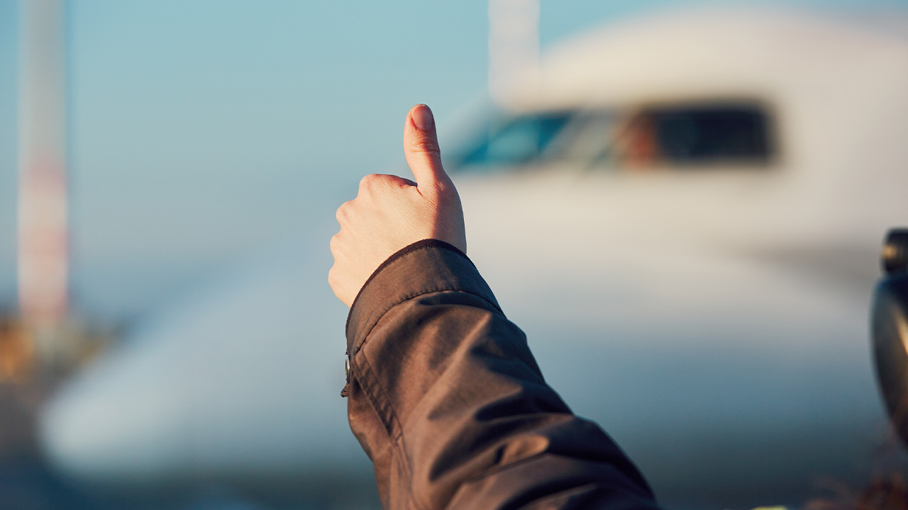 thumbs up with aircraft