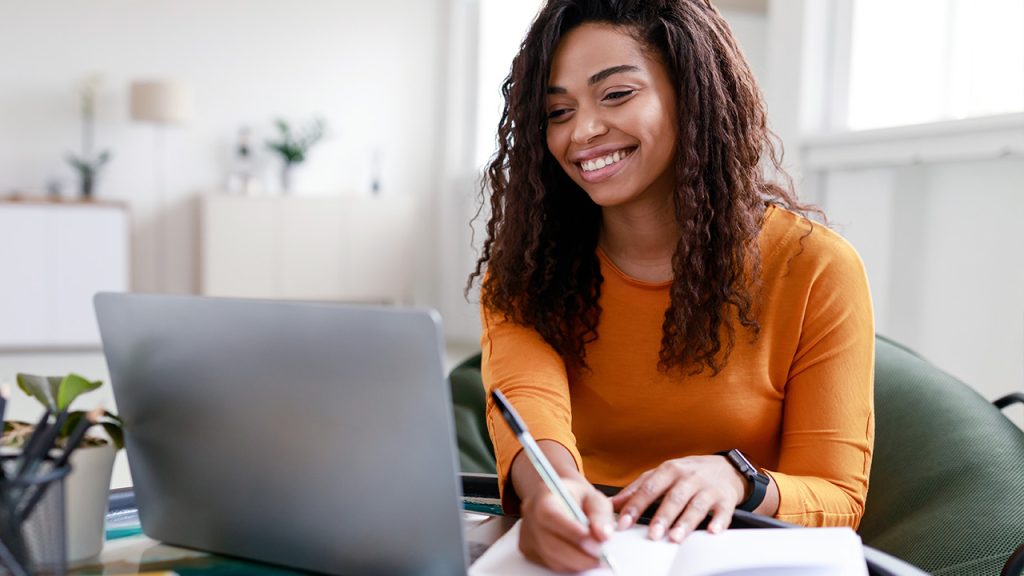 young woman working on a laptop